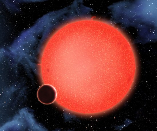 Impresión artística de la ‘supertierra’ GJ 1214b y la estrella a la que orbita, una enana roja a unos 42 años luz de la Tierra. Credit: NASA, ESA, and D. Aguilar (Harvard-Smithsonian Center for Astrophysics).